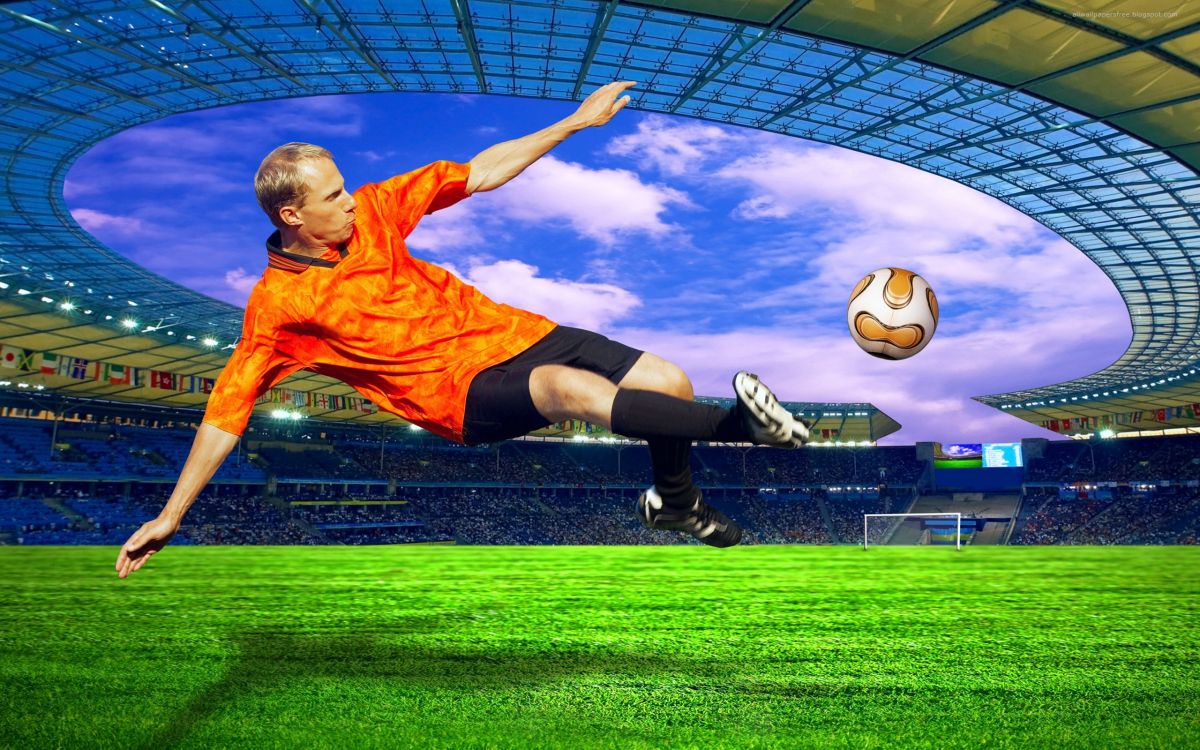 Mann in Orangefarbenem Nike-Fußball-Trikot Und Schwarzen Shorts Beim Fußballspielen. Wallpaper in 2560x1600 Resolution