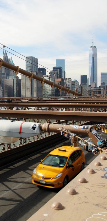 Image yellow taxi on bridge during daytime