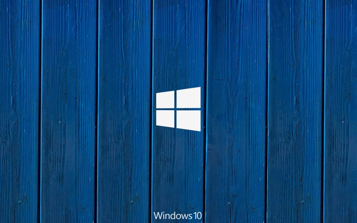 blue wooden door with white and red cross