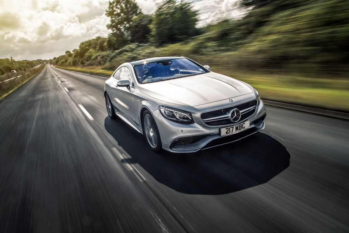 black mercedes benz coupe on road during daytime