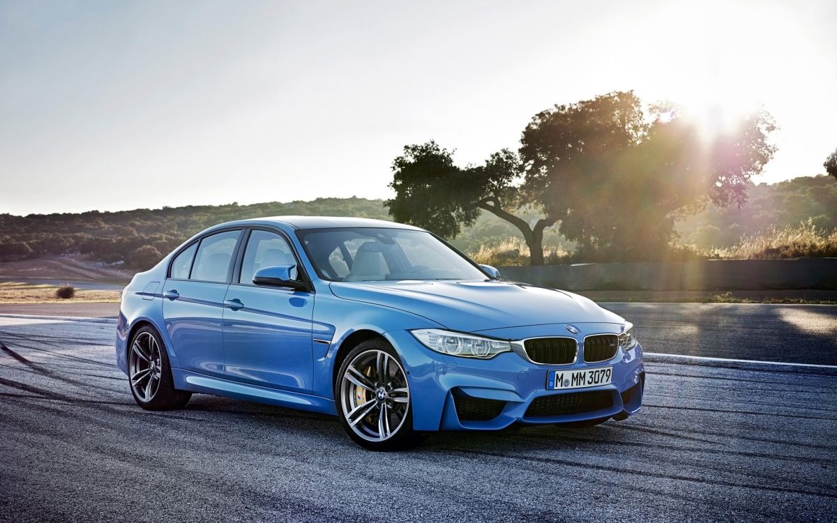 blue bmw m 3 coupe on road