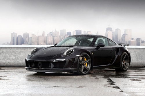 Image black porsche 911 parked on gray pavement during daytime