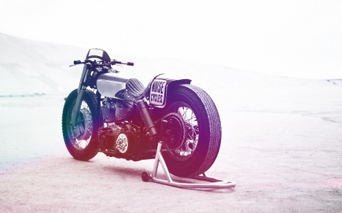 Image black and red motorcycle on snow covered ground