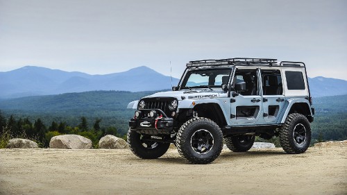 Image black jeep wrangler on dirt road during daytime