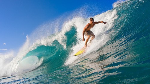 Image man surfing on blue sea during daytime