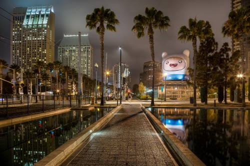 Image city buildings with lights turned on during night time