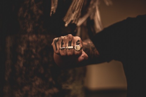 Image grayscale photo of person holding ring