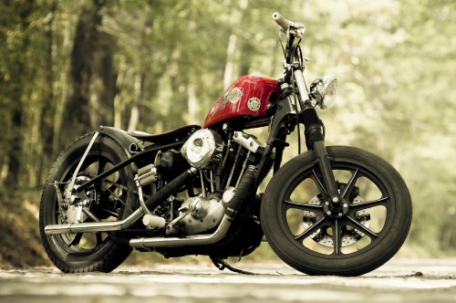 Image black and red motorcycle in the middle of the road