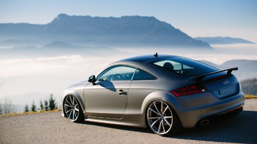 Image blue porsche 911 on gray concrete pavement