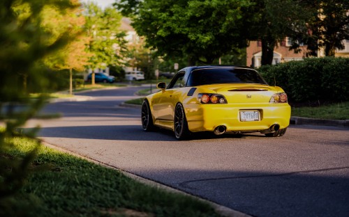 Image yellow porsche 911 on road during daytime