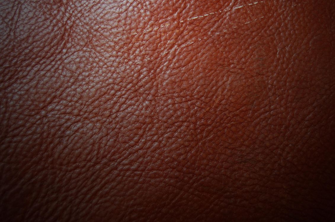 brown leather textile in close up photography