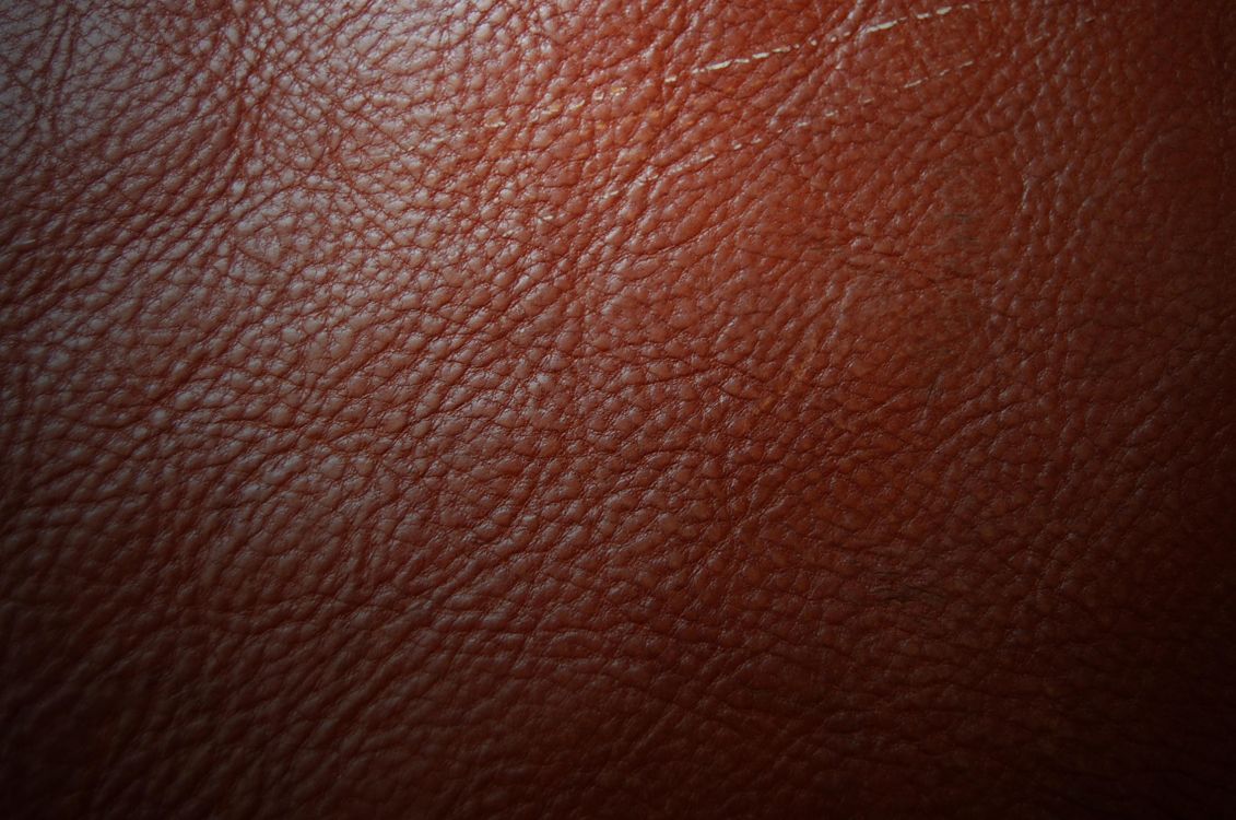 Braunes Ledertextil in Nahaufnahmen. Wallpaper in 2256x1496 Resolution