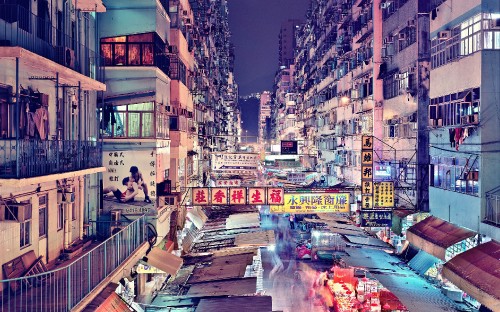 Image people walking on street during night time