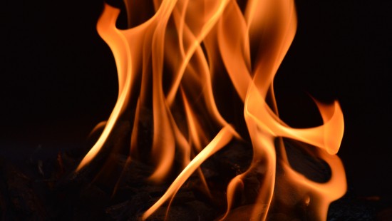Image orange fire in black background
